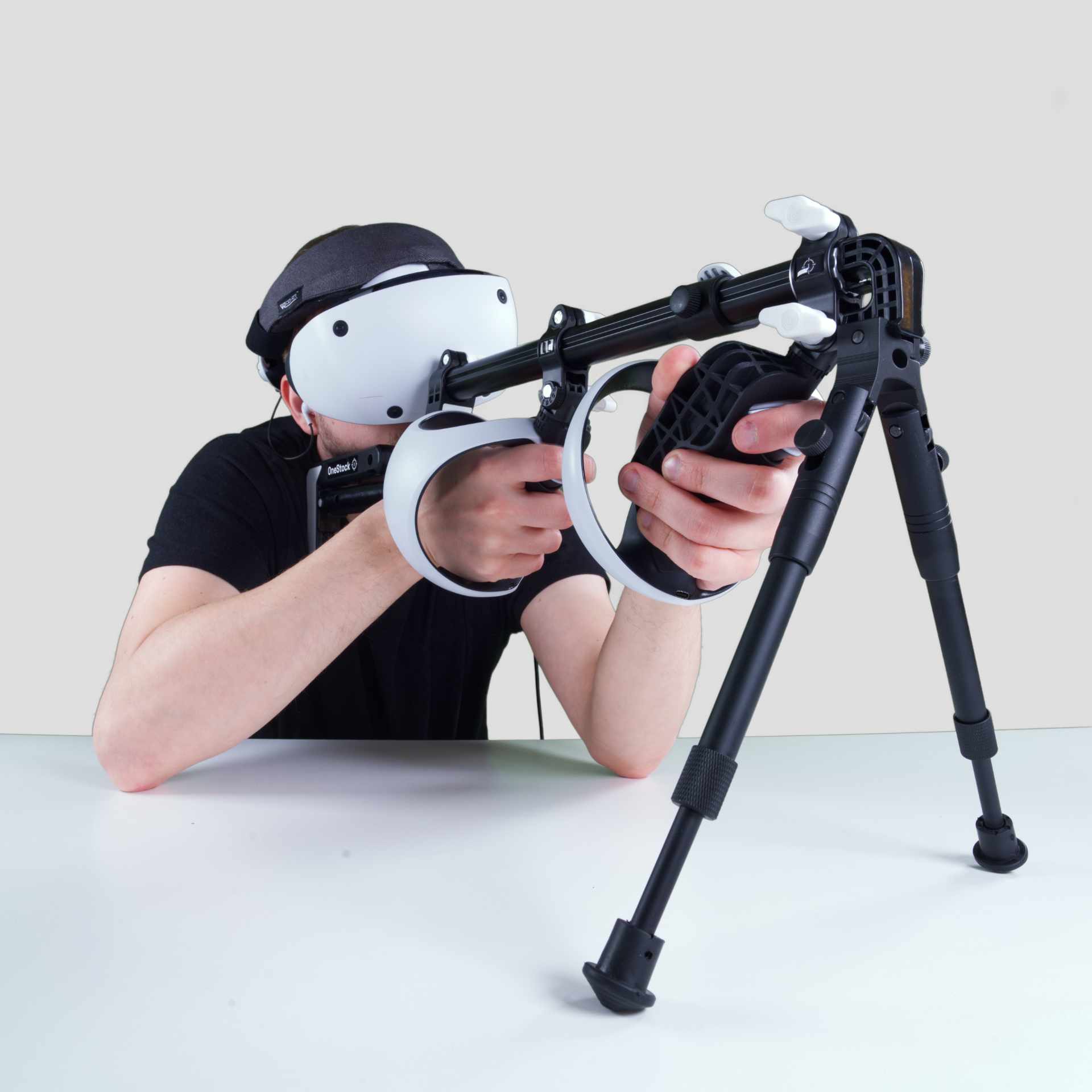 Man holding a Wield VR OneStock VR gunstock PSVR2 model with bipod add-on on a table mounted